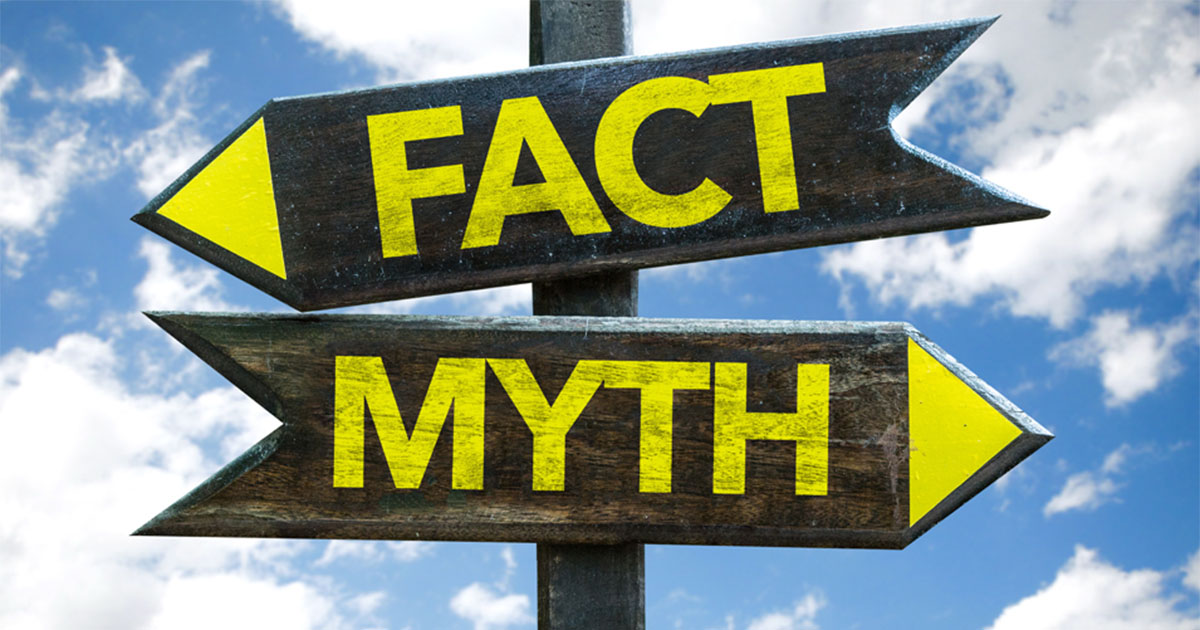 A road sign post with two arrows pointing in opposite directions that reads, 'Fact' and 'Myth'.