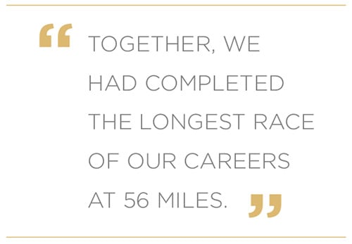A quote graphic that reads, 'Together, we had completed the longest race of our careers at 56 miles'.