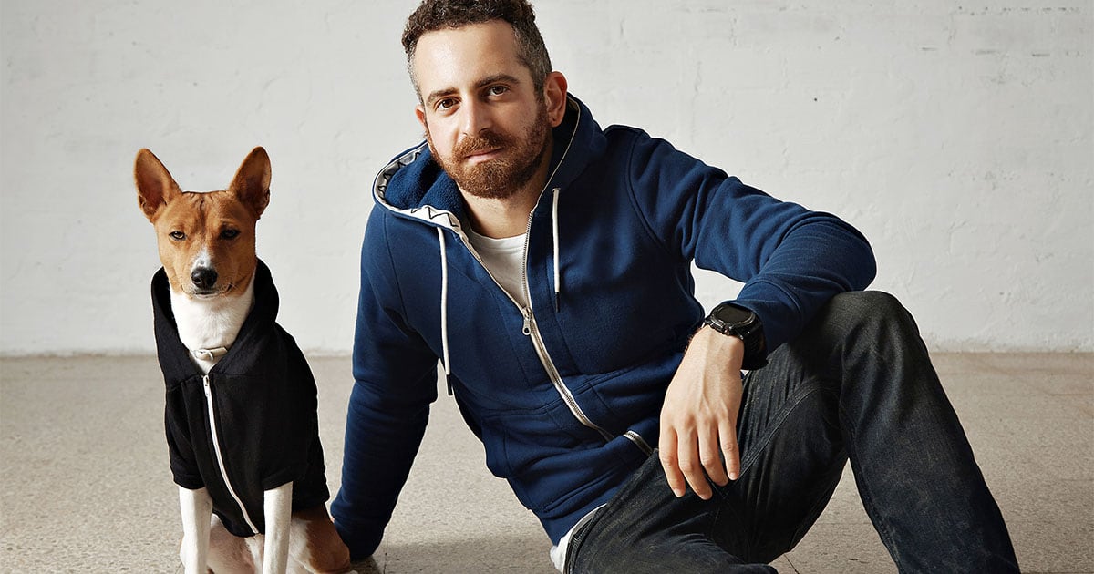 Dog and Owner Wearing Hooded Sweatshirts | Diamond Pet Foods