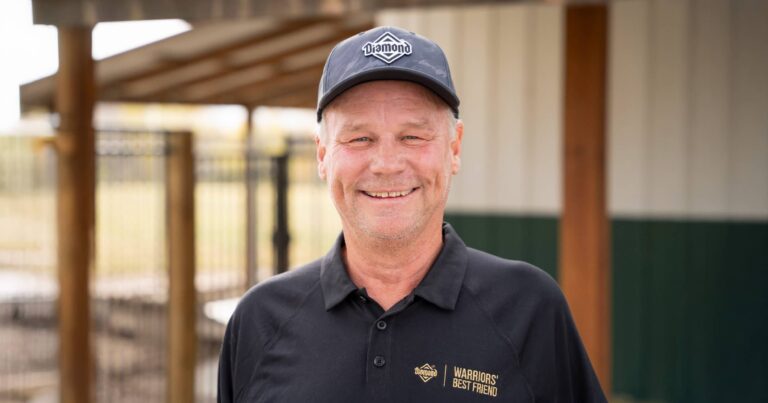 A close-up of Joe Jeffers, founder of Warriors’ Best Friend, smiling and wearing a Diamond Pet Foods hat.
