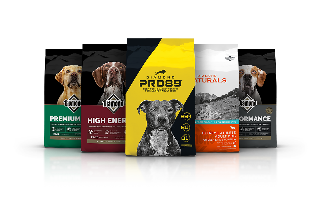 An assortment of Diamond Pet Foods dog formula bags lined up side by side.